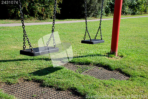 Image of Two empty swings