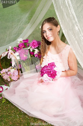 Image of beautiful woman with flower...