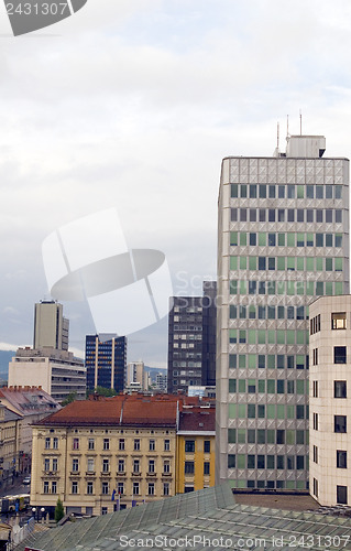 Image of cityscape rooftop view  office buildings apartments condos busin