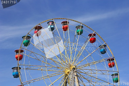 Image of Atraktsion colorful ferris wheel against the blue sky