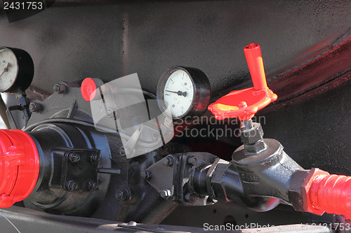 Image of faucet and pressure gauge fire truck