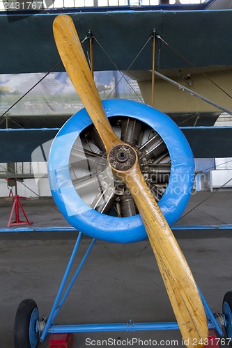 Image of Old aircraft engine with wood propeller, vintage plane close up