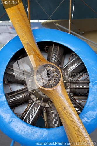 Image of Old aircraft engine with wood propeller, vintage plane close up