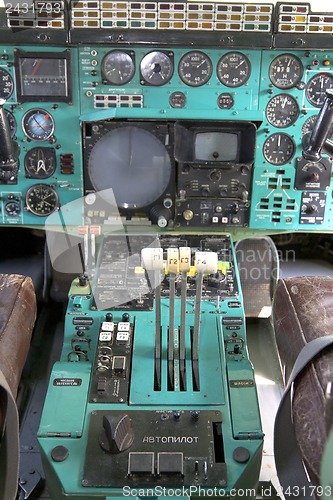 Image of Airplane Cockpit thrust levers with hand on top for takeoff, Tu-