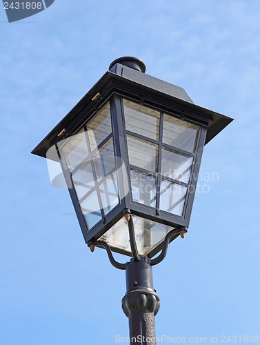 Image of street lamp against the background of blue sky