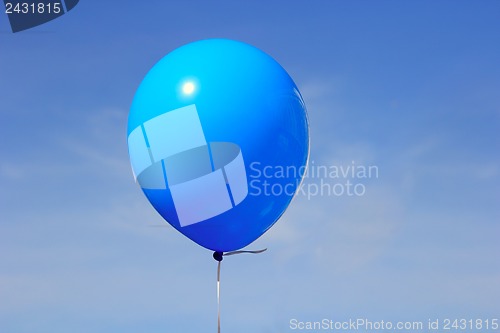 Image of Inflatable balloon, photo on the against the blue sky