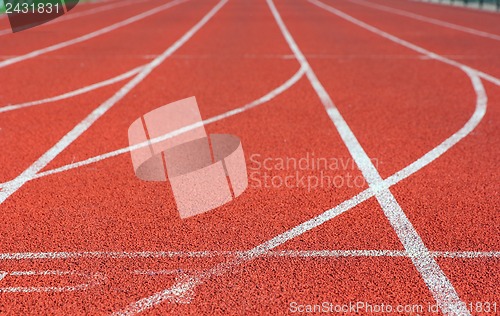 Image of Red treadmill at the stadium with white lines 