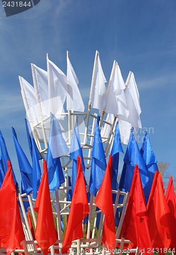 Image of colored flags on a blue sky background