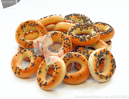 Image of Drying bagels with poppy seeds on a white background