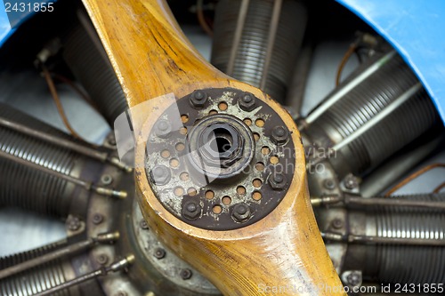 Image of Old aircraft engine with wood propeller, vintage plane close up