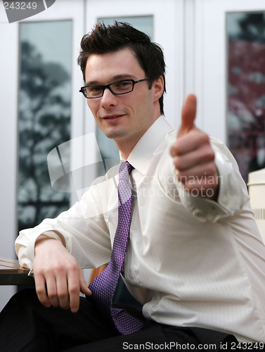 Image of Businessman gives the thumbs up