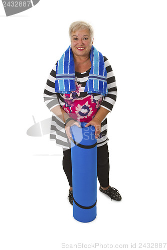 Image of Female senior with blue gym mat 