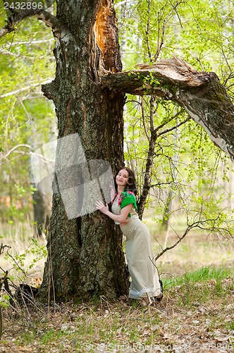 Image of Beautiful woman near birch