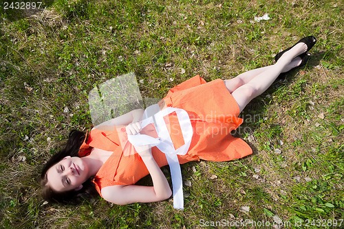 Image of Pretty girl laying on grass