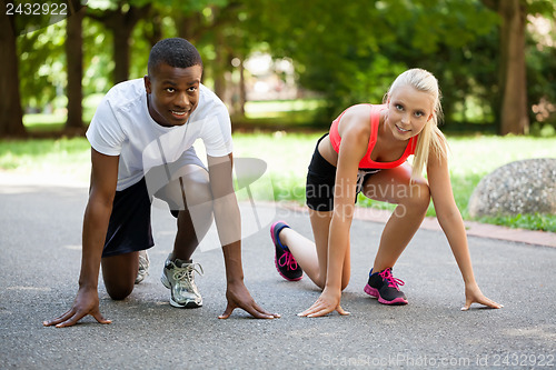 Image of young couple runner jogger in park outdoor summer