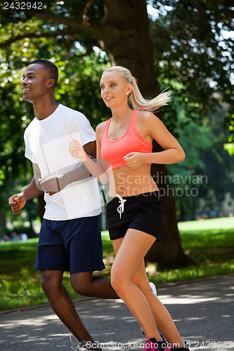 Image of young couple runner jogger in park outdoor summer