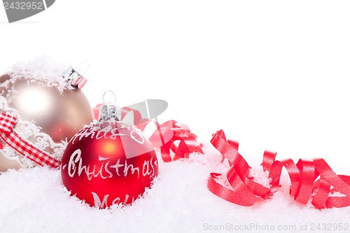 Image of christmas decoration festive red bauble in snow isolated