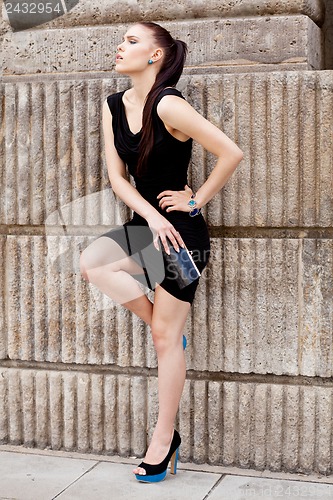 Image of attractive brunette young woman in summer outdoor 