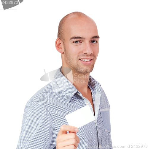 Image of young successful businessman with blank business card