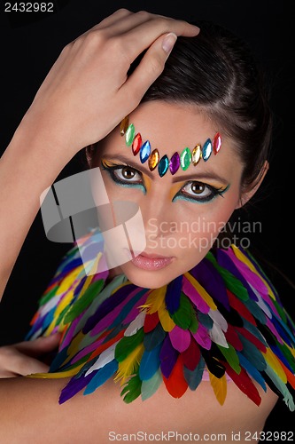 Image of beautiful woman with colorful extreme makeup and accessoires