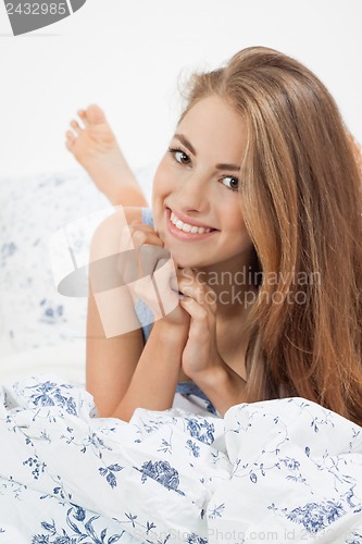 Image of young brunette woman lying in bed sleeping morning 