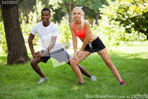 Image of young couple runner jogger in park outdoor summer