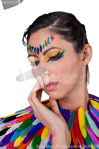 Image of beautiful woman with colorful extreme makeup and accessoires