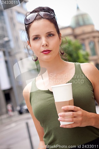 Image of attractive woman with sunglasses in the city summertime