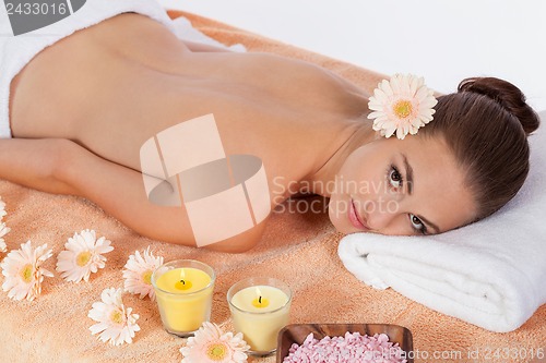 Image of attractive healthy caucasian woman hot stone massage wellness 