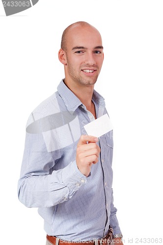 Image of young successful businessman with blank business card