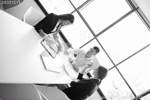 Image of business people in a meeting at office