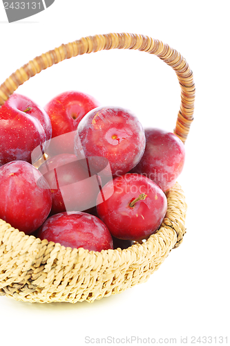 Image of Basket with red plums.