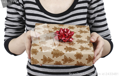 Image of Young woman holding a present