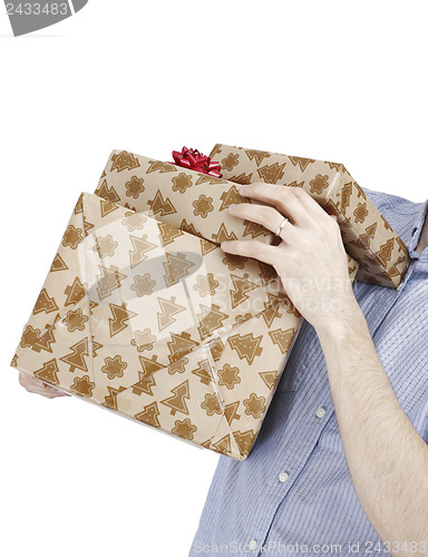 Image of Young man holding a present