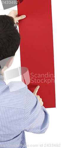 Image of Man holding a paper