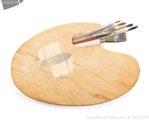 Image of Brushes and a palette of the painter