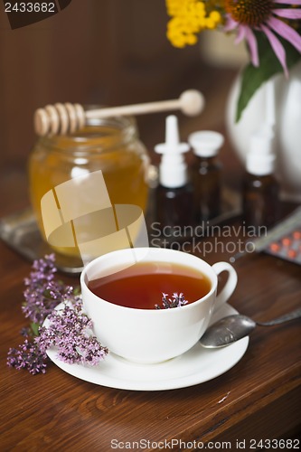 Image of Still life from medicinal herbs, honey, herbal tea and medicines