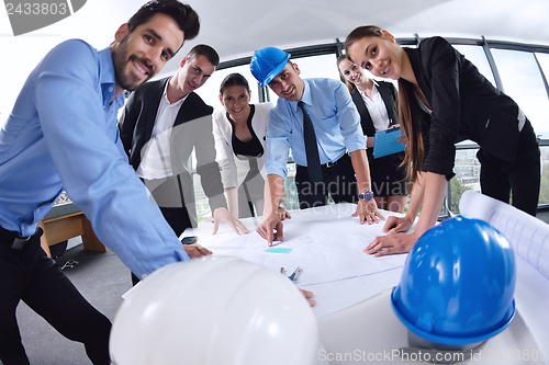 Image of business people and engineers on meeting