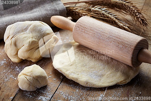 Image of fresh dough and rolling pin