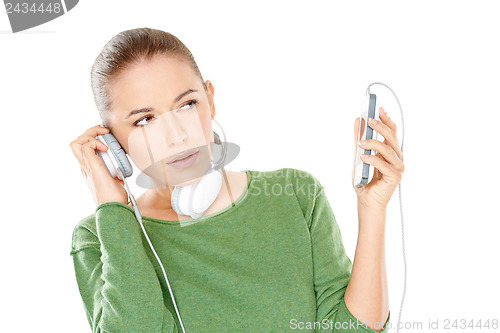 Image of Woman listening to a new music download