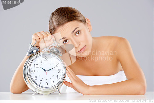 Image of Bored young woman counting down the time