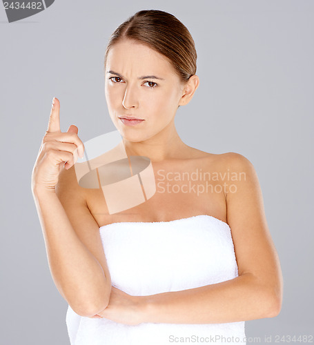 Image of Frowning woman pointing her finger