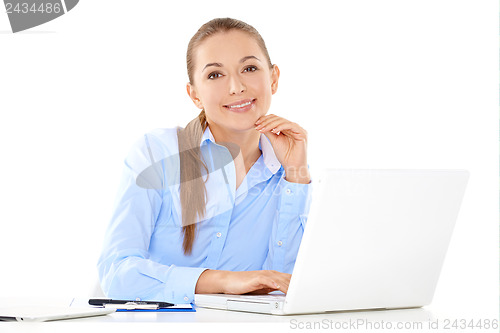 Image of Smiling businesswoman working on a laptop