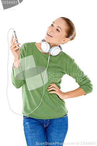Image of Young woman enjoying her music