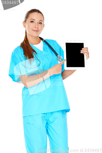 Image of Smiling nurse pointing to a tablet-pc