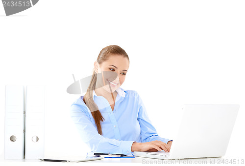 Image of Smiling businesswoman working on a laptop