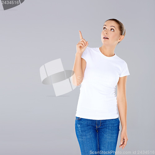 Image of Woman looking up and pointing