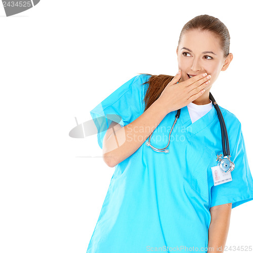 Image of Pretty young nurse trying to hide her amusement