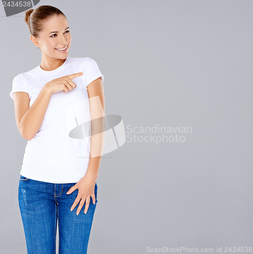 Image of Woman pointing with a smile