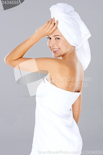 Image of Beautiful woman wrapped in towels at a spa